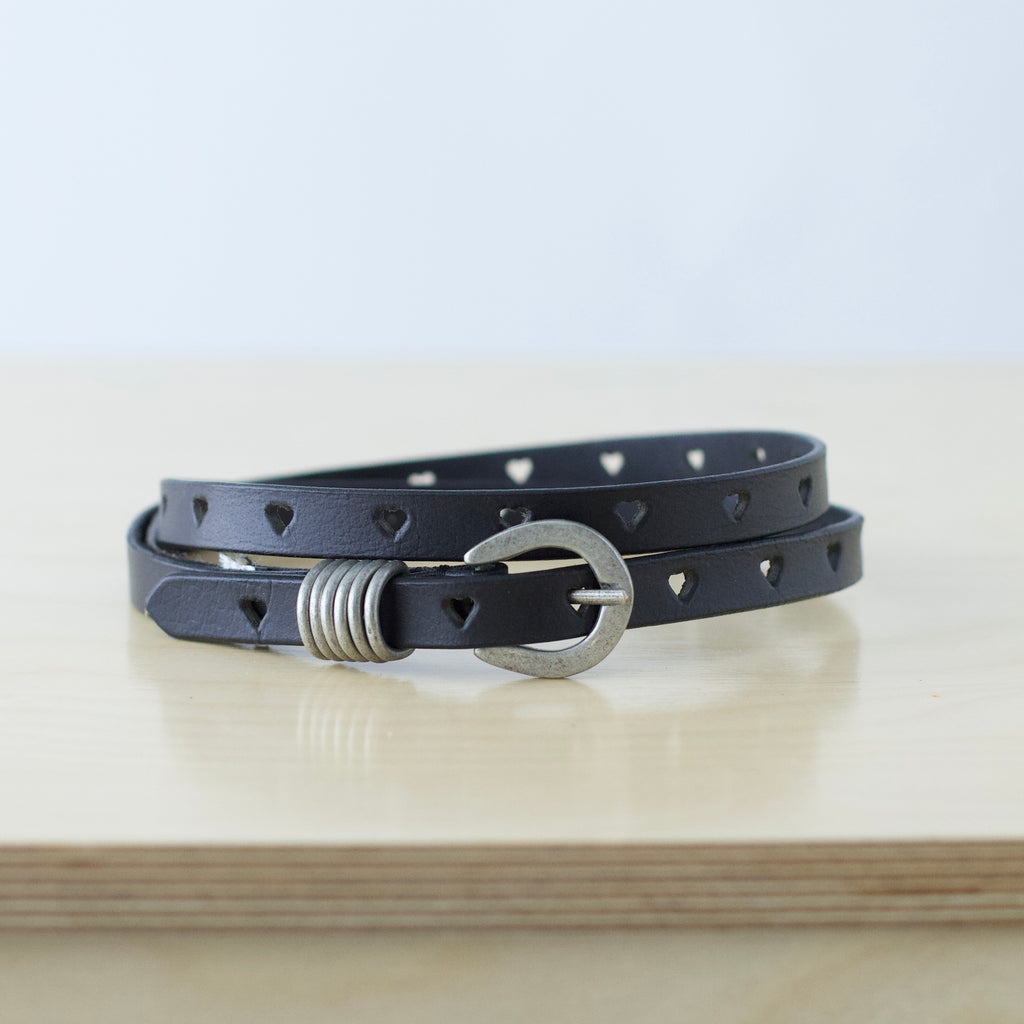 S/M Free People black leather belt with heart shaped cut outs
