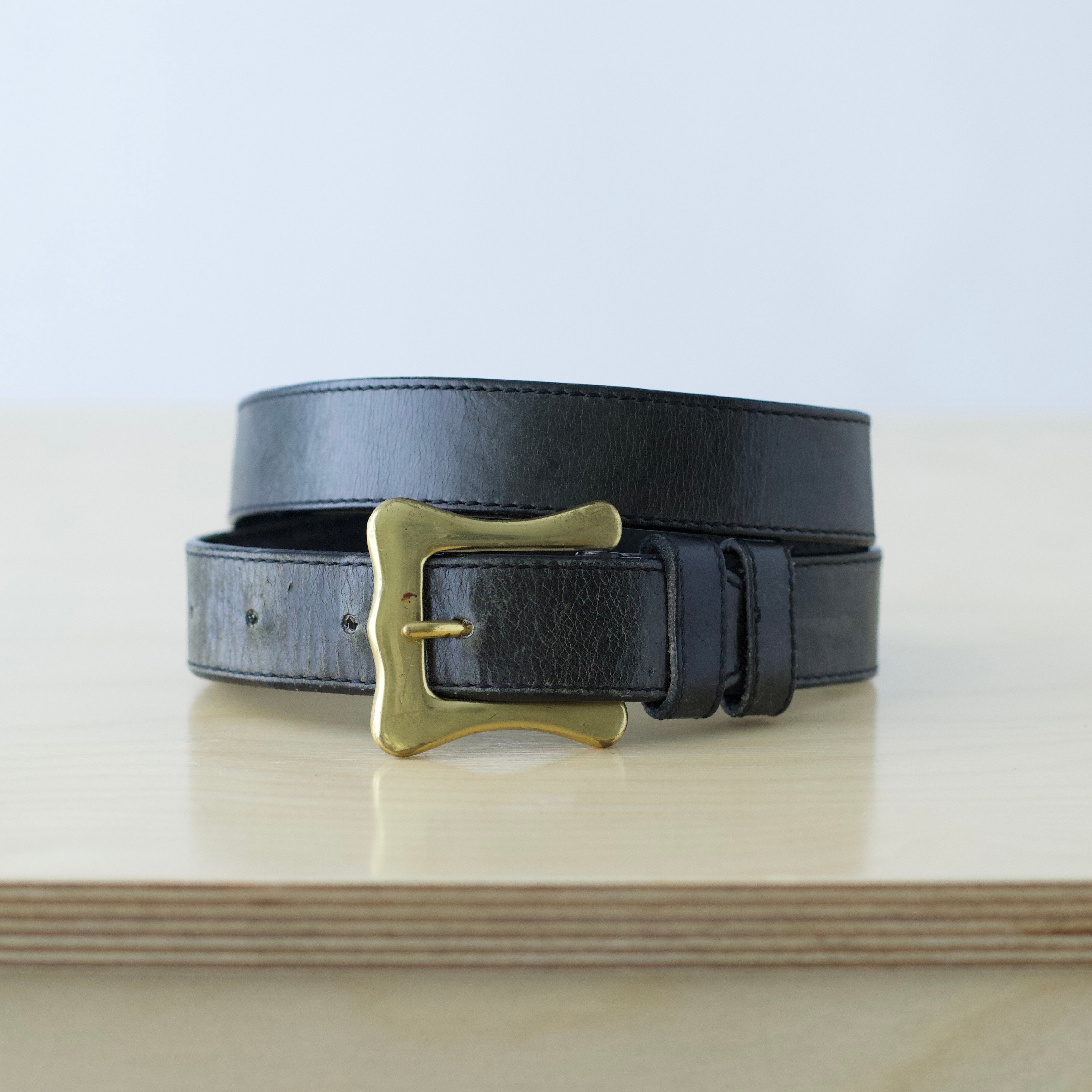 S/M Vintage black leather belt with unique brass hardware